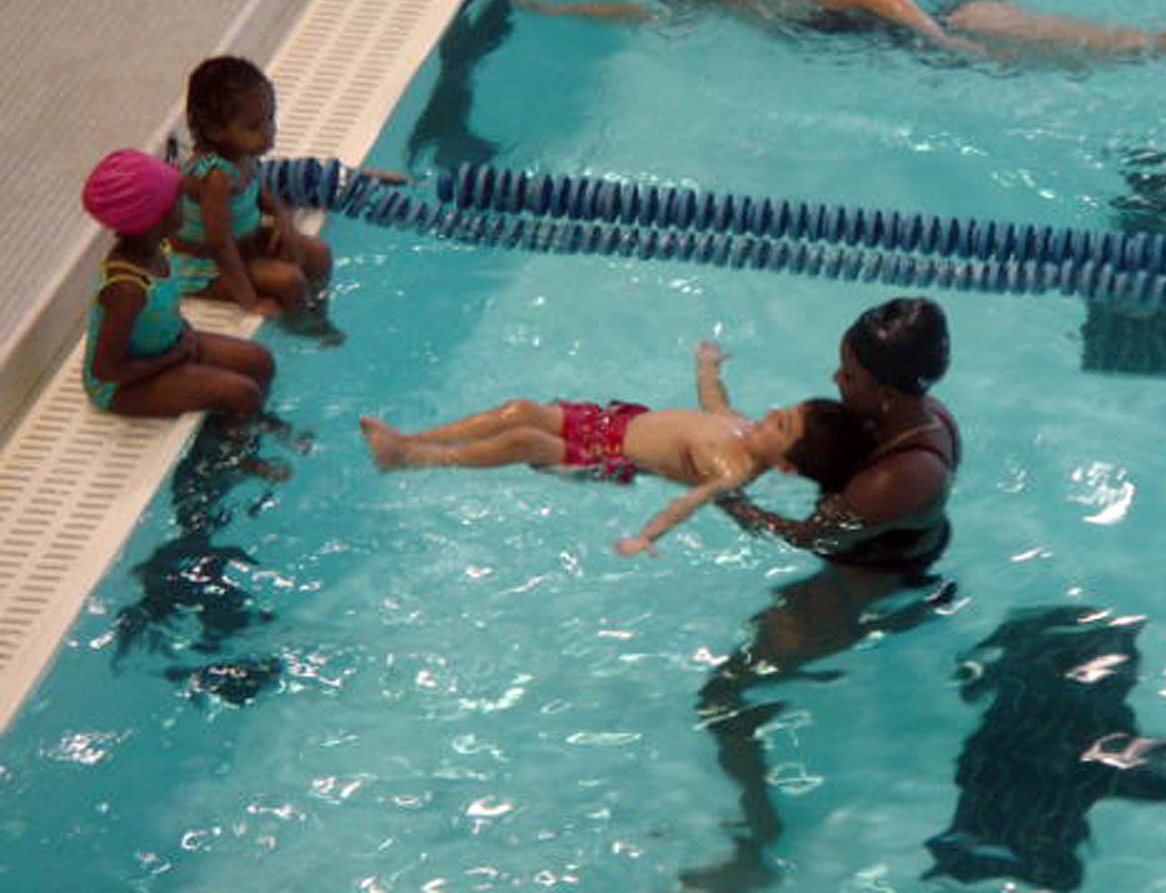 -Diego Cid learns to float as part of his DPR swim class at I.R. Holmes, Sr. Recreation Center at Campus Hills. Photo by Lisa Paulin-Cid