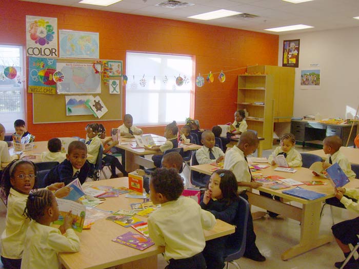 Students listen to an early-morning lesson at Union Independent School. The bright colors in the room are designed to stimulate learning.