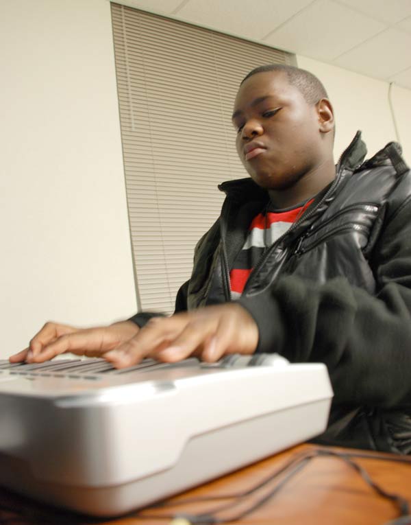 Working on a new beat, Michael McCrae plays his keyboard at Jus' Like Us, an after-school mentoring program at the Holton Career and Resource Center.
