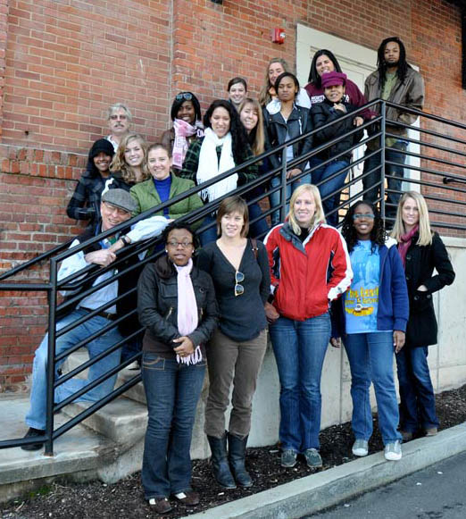 Gathered outside their new newsroom in Building 4 of the Golden Belt campus on East Main Street, some of the VOICE staffers from Durham, NCCU and UNC pose for a group shot: (front to back, left to right) Corliss Pauling, Catherine Rierson, Katy Millberg, Teen Editor Zenzele Barnes and Teen Coordinator Carly Brantmeyer; second row, UNC Co-adviser Jock Lauterer, NCCU Co-adviser Lisa Paulin, Latisha Catchatoorian, Elizabeth Jenson, Chavaria Williams, Nakia Jones; back row, Briana Aguilar, Sarah Rankin, NCCU Co-adviser Bruce “DP” dePyssler, Ashley Griffin, Lindsay Ruebens, Allie McCoy, Ashley Rogue and Phil Landingham. (Photo by Donna Barnes)