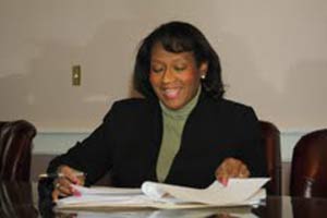Deborah Craig-Ray, assistant Durham County manager, reviews applications for the Durham Neighborhood College. Photo by Willie Pace.